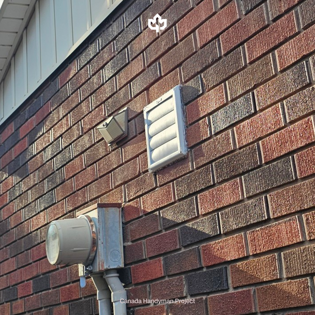 Hamilton Ontario Over-the-Range Microwave Installation Canada Handyman LG Microwave vent to the outside with a hole cut in the brick
